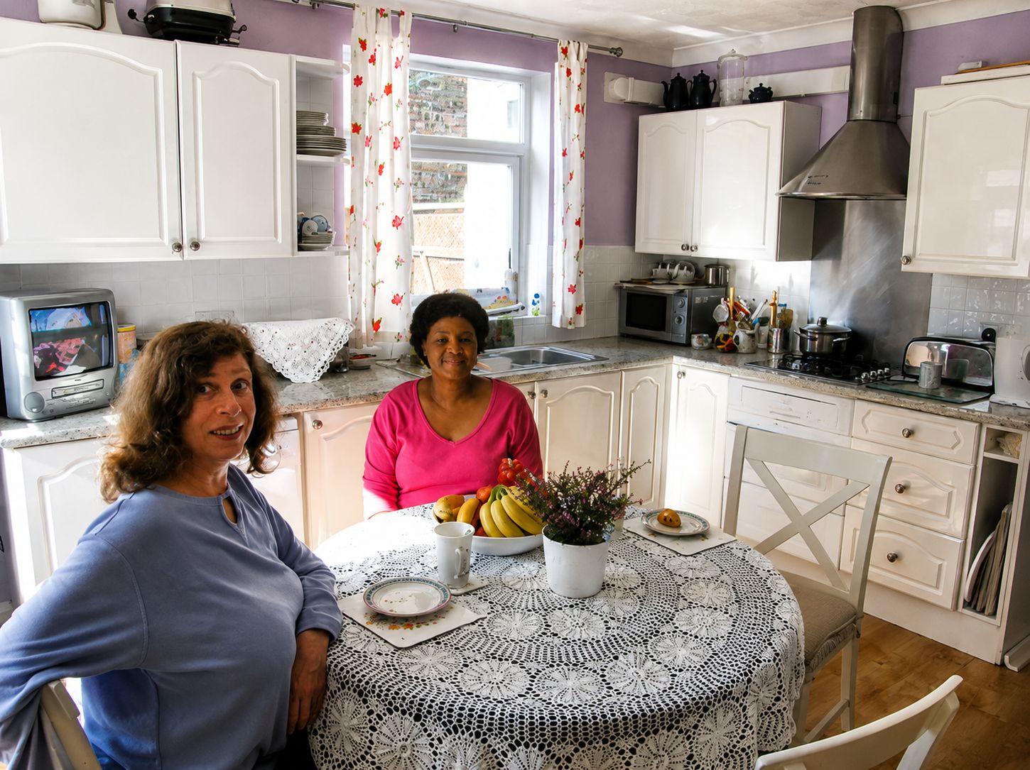 Residents together in the kitchen and dining area.